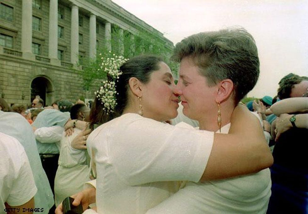 1993 - A lesbian couple embrace after exchanging wedding vows at an interfaith commitment ceremony in front of the IRS building in Washington, DC