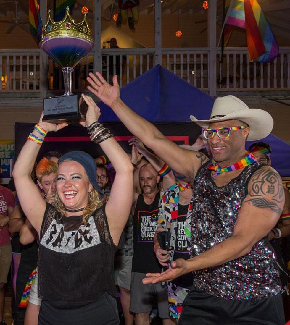 2016 Champion Rocky Collins gives 2017 Champion Kayla Hasbrook her trophy.