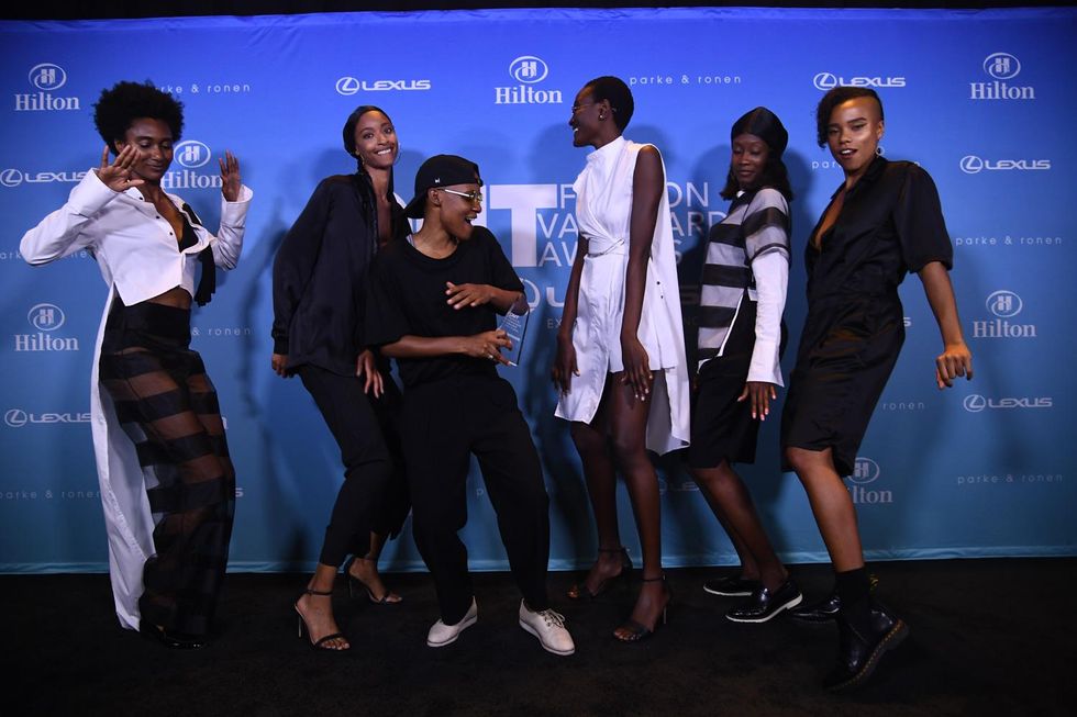 2018 OUT Fashion Vanguard winner Kris Harring celebrates with her models