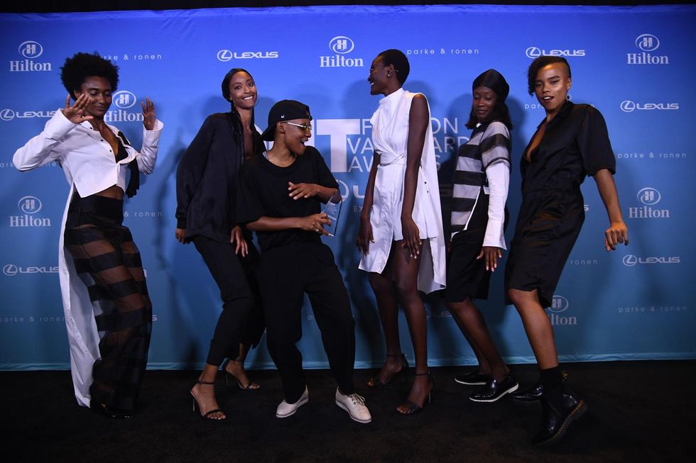 2018 OUT Fashion Vanguard winner Kris Harring celebrates with her models