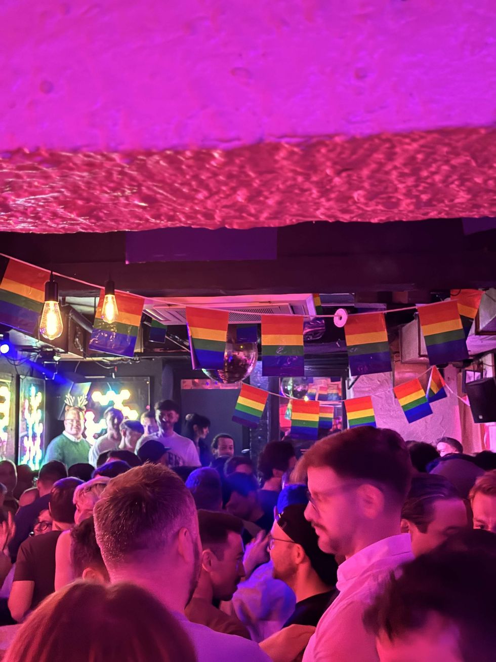 A bar filled with patrons