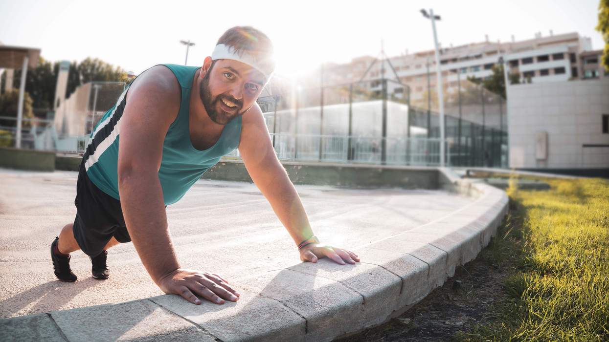 A bear doing pushups.
