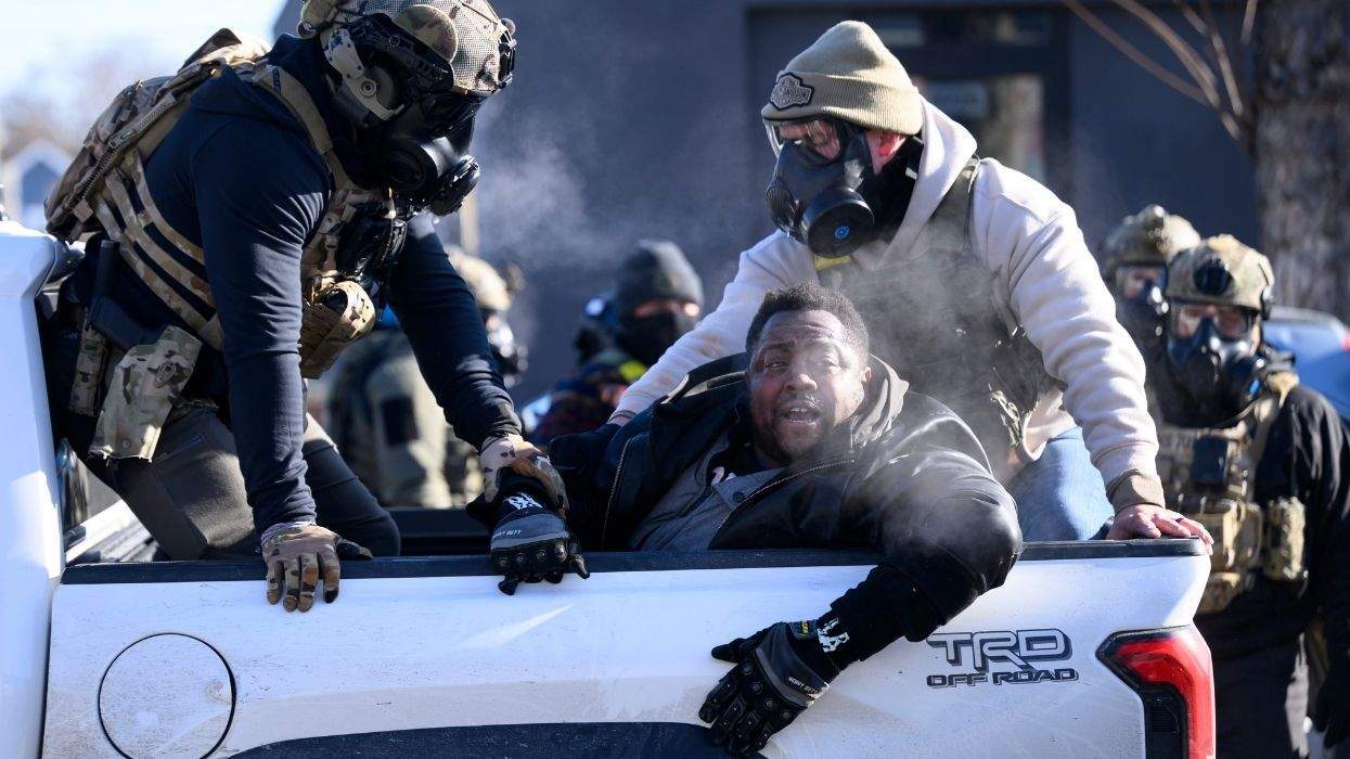 a black man taken by masked federal immigration agents