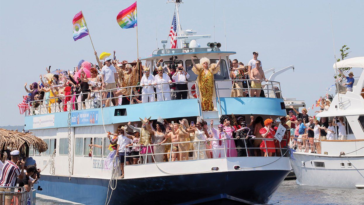 a boat carrying drag queens enters the harbor at fire island