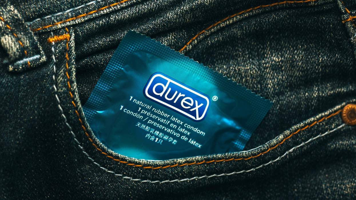 A condom in the pocket of a pair of jeans.