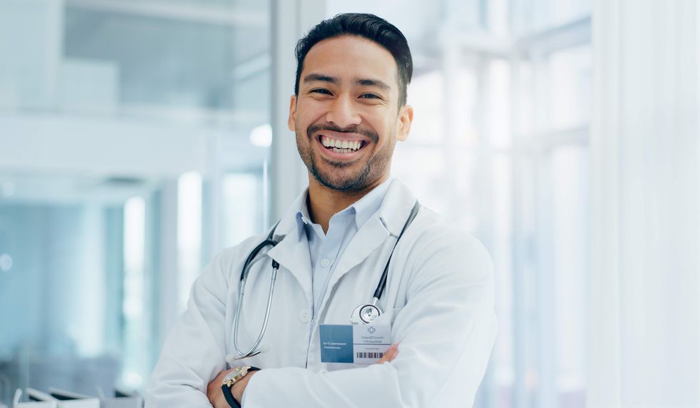 A doctor in a lab coat.
