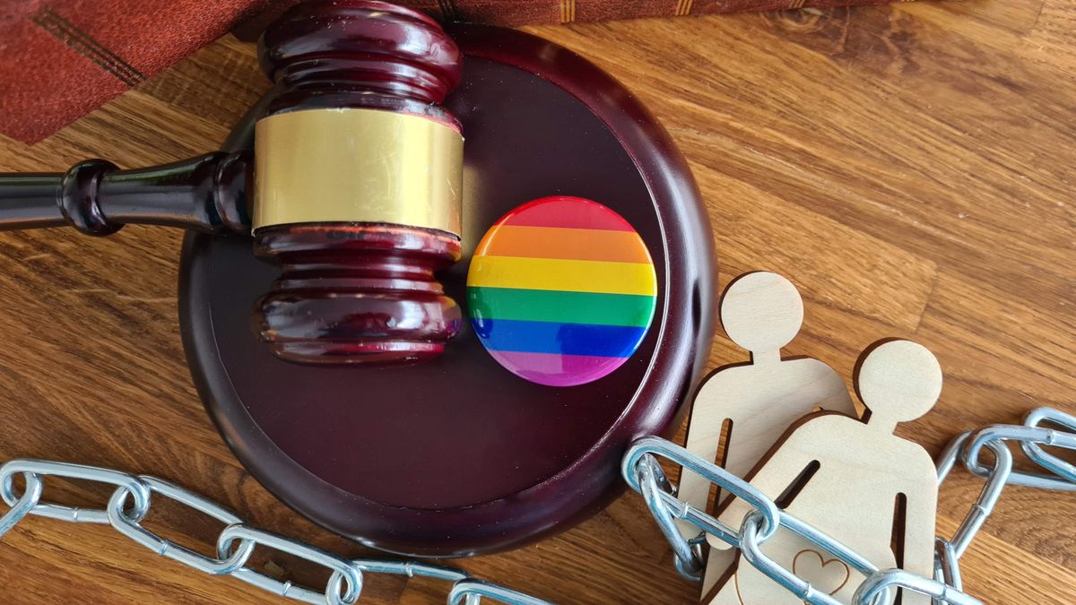 a judge's gavel and rainbow pin