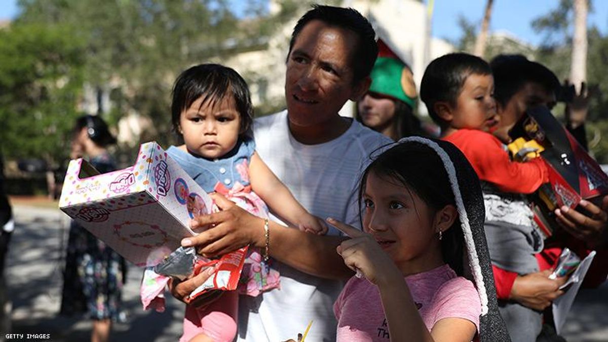 A migrant family from Guatemala receives gifts for the holidays