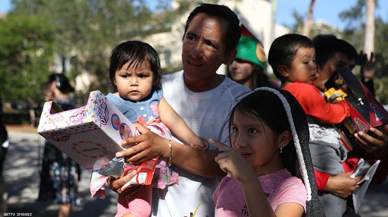 A migrant family from Guatemala receives gifts for the holidays