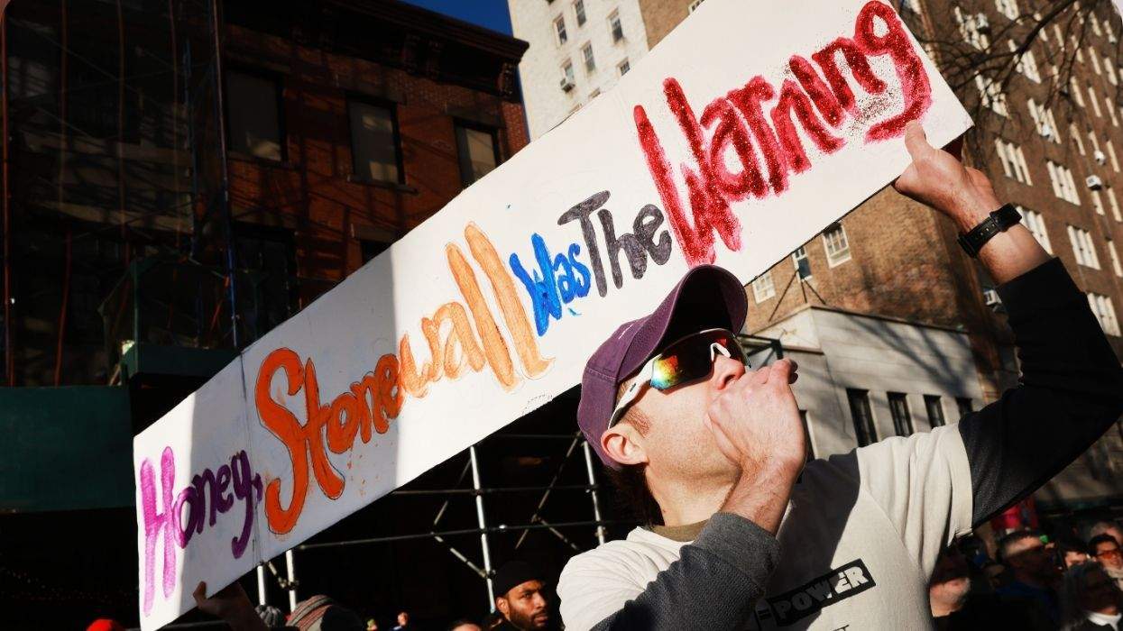 a person holds a sign that reads honey stonewall was the warning