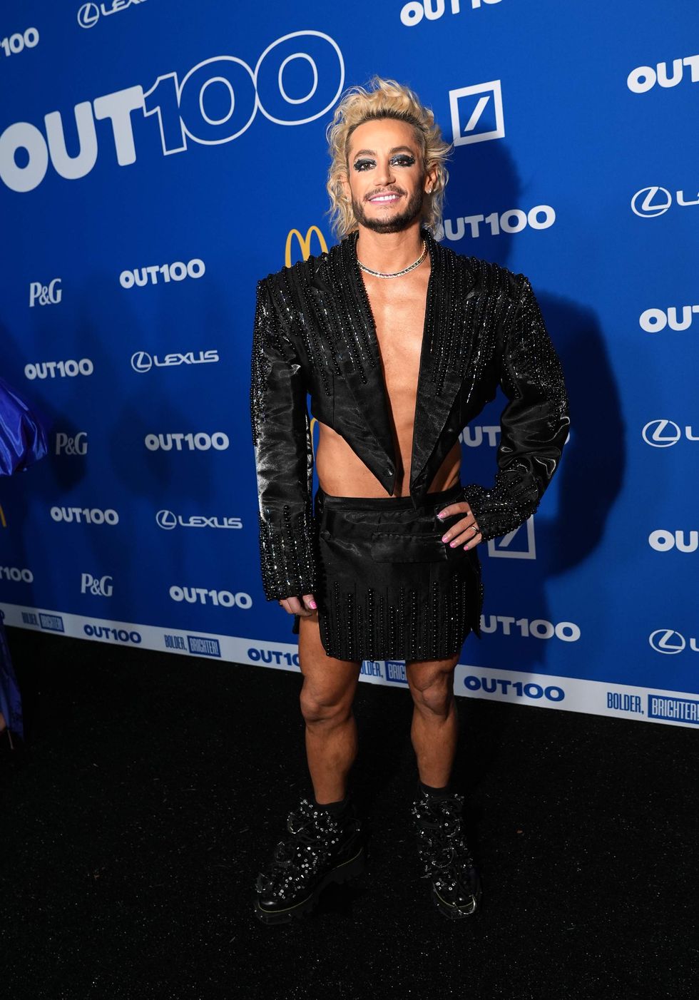 A person posing on a red carpet