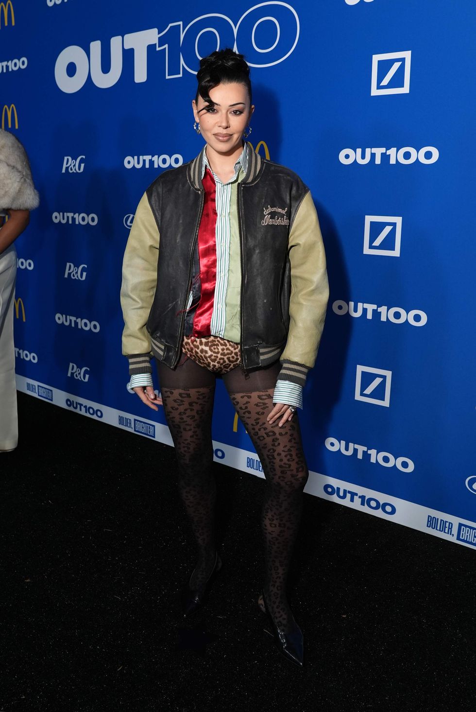 A person posing on a red carpet