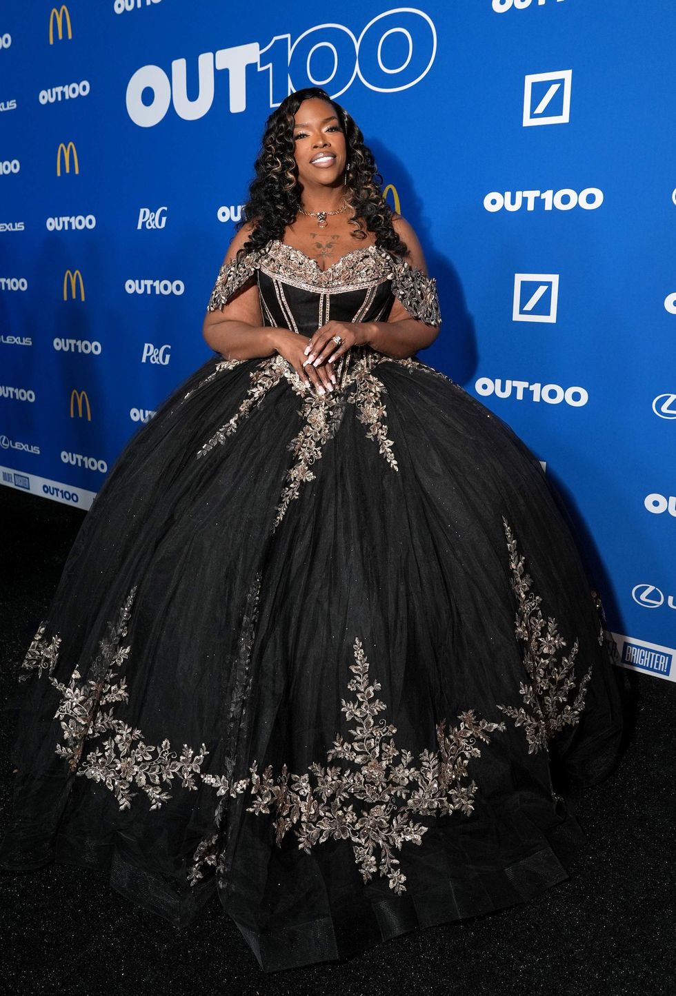 A person posing on a red carpet