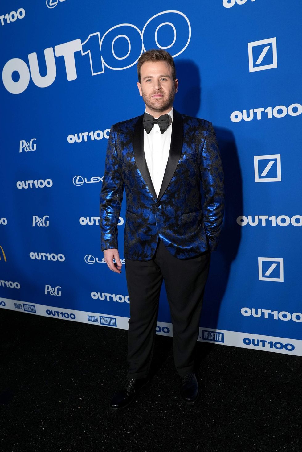 A person posing on a red carpet