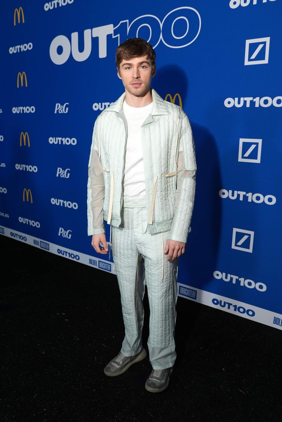 A person posing on a red carpet