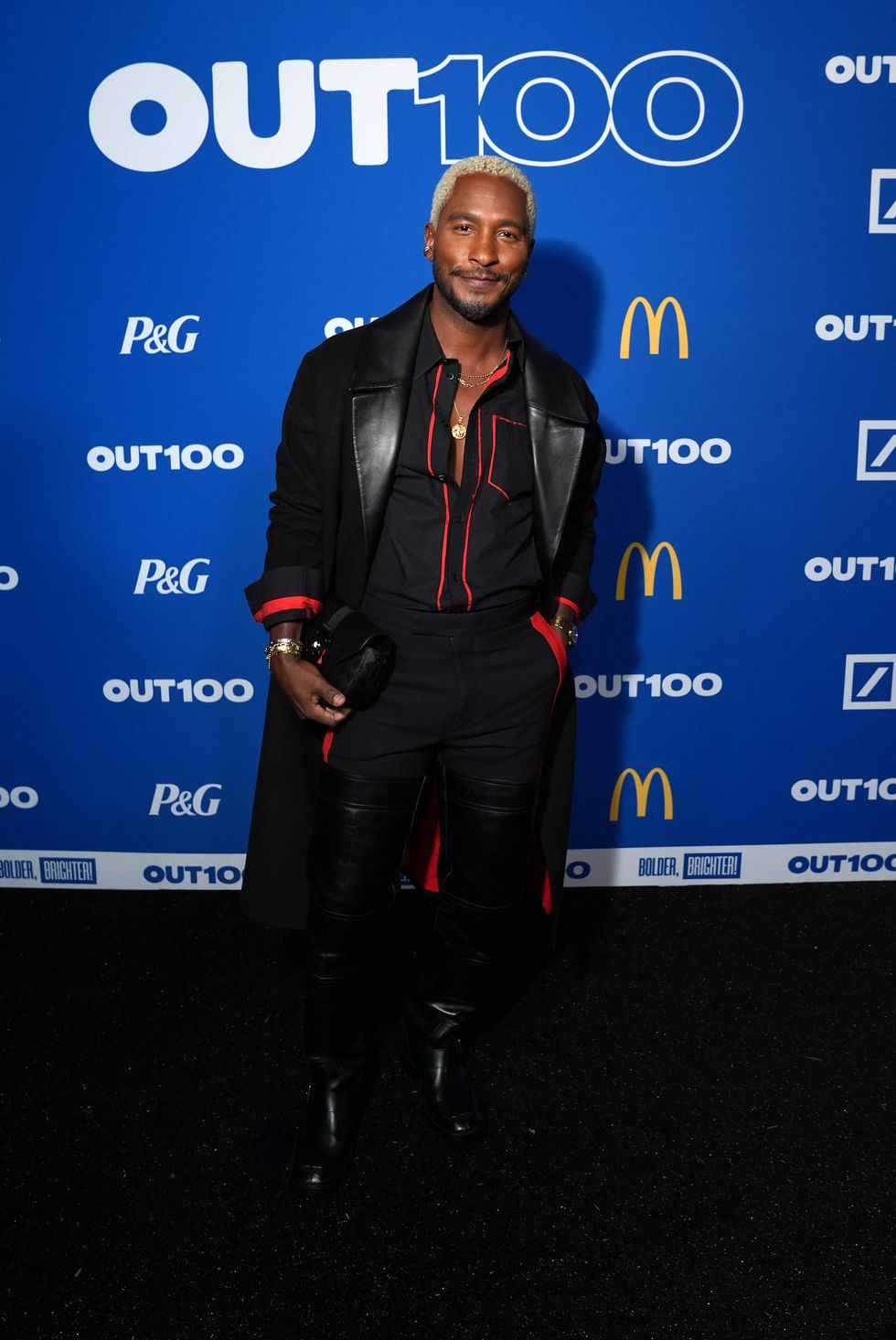 A person posing on a red carpet