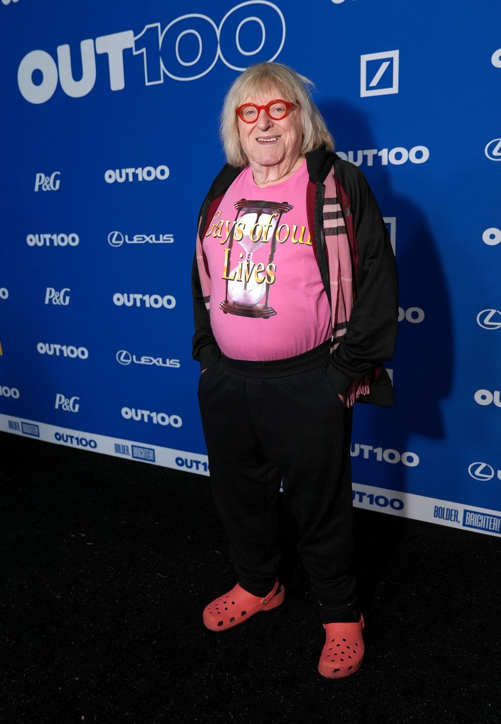 A person posing on a red carpet