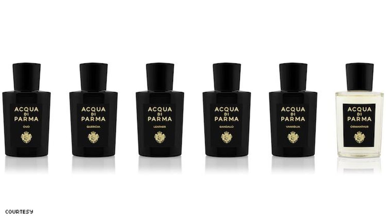 A row of fragrance bottles.