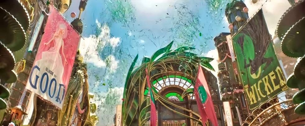 A scene in Emerald City displaying posters for Glinda the Good and The Wicked Witch