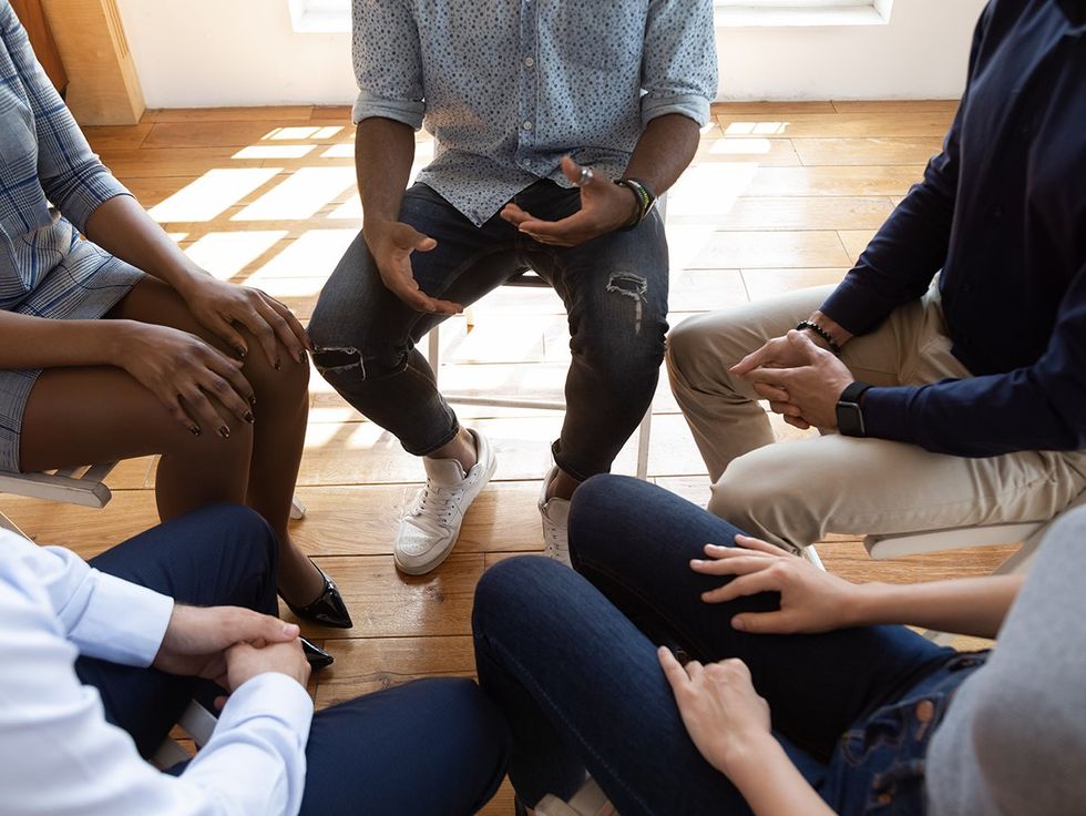 above view diverse LGBTQIA support group circle