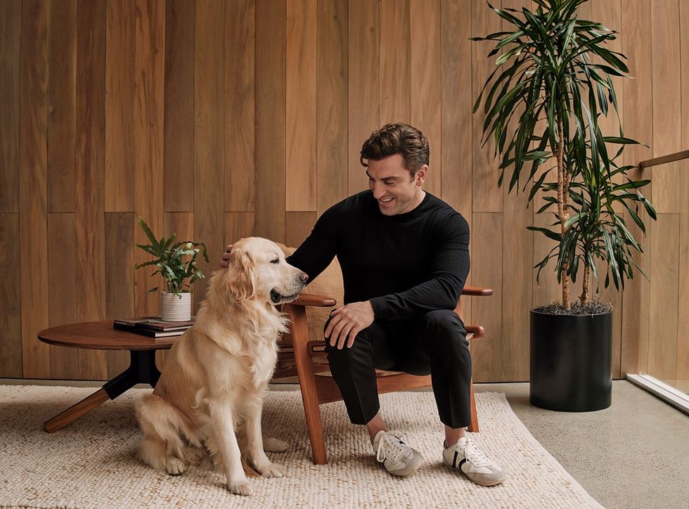 Airbnb Co-Founder and CEO Brian Chesky, pictured with a very good boy