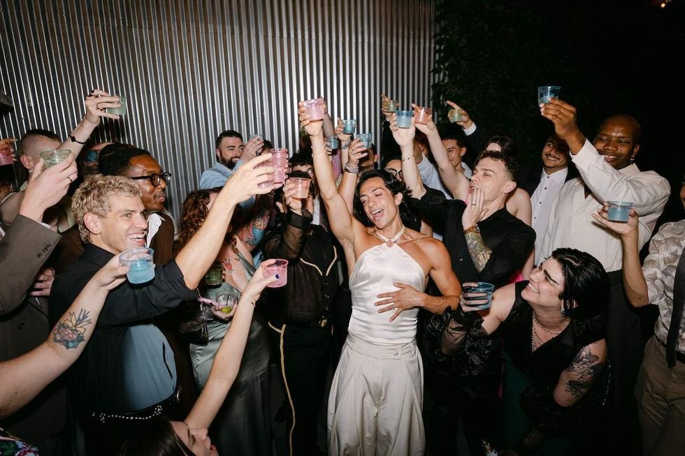 Alexander Montgomery and Cordero Zuckerman dance with their wedding guests.