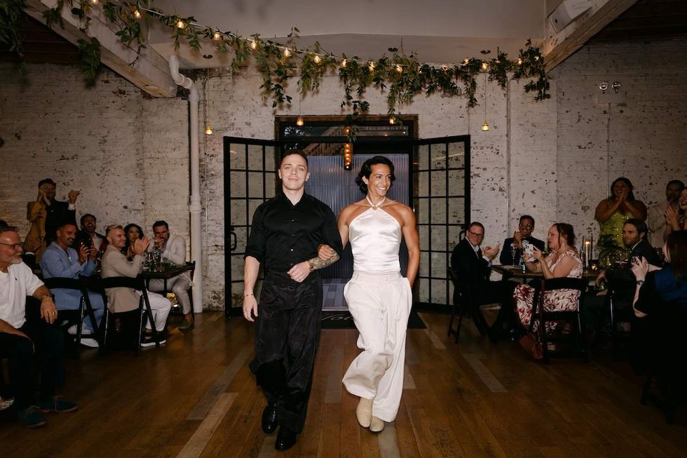 Alexander Montgomery, left, and Cordero Zuckerman wore custom designs made for them by Project Runway finalist, Utica Queen, at their reception.
