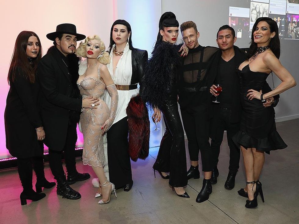 Amanda Lepore and R. Kurt Osenlund pose with guests