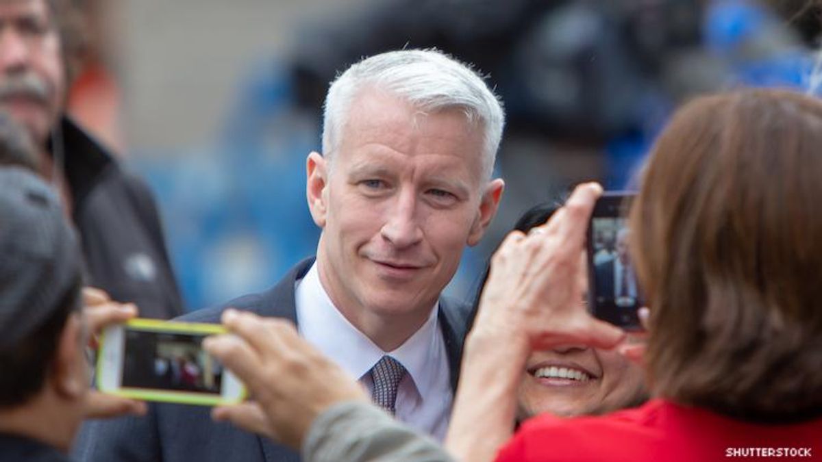 Anderson cooper with a fan.