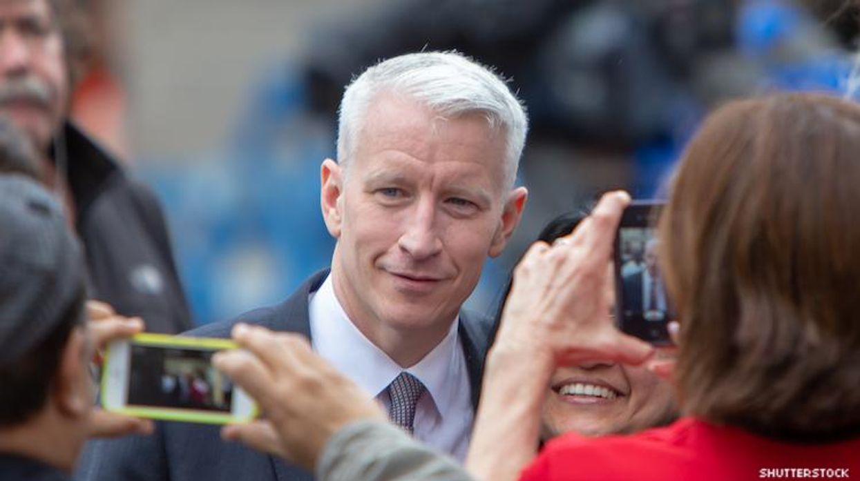 Anderson cooper with a fan.