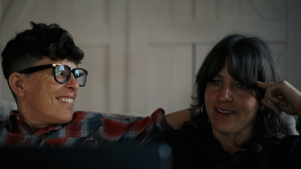 Andrea Gibson looking at their partner and smiling