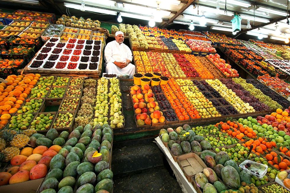 Arabian man on the street sells local vegetable and fruits in Thoif Saudi Arabia