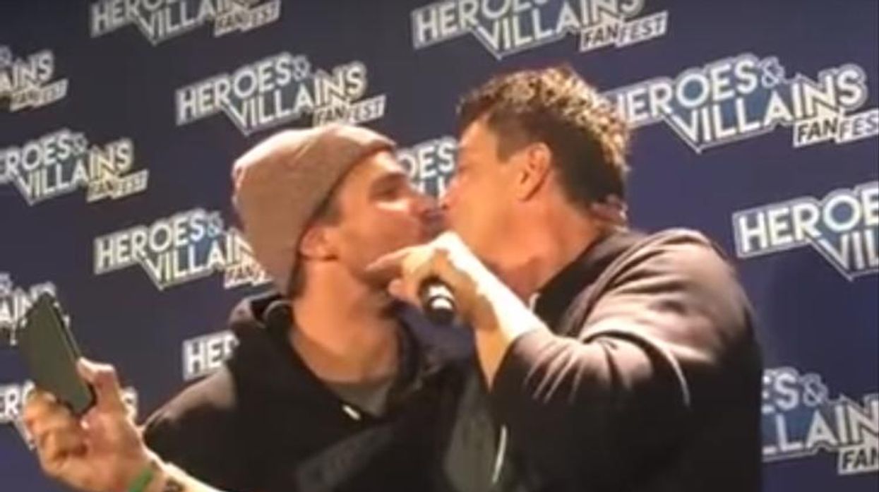 Arrow stars Amell and Barrowman kiss.