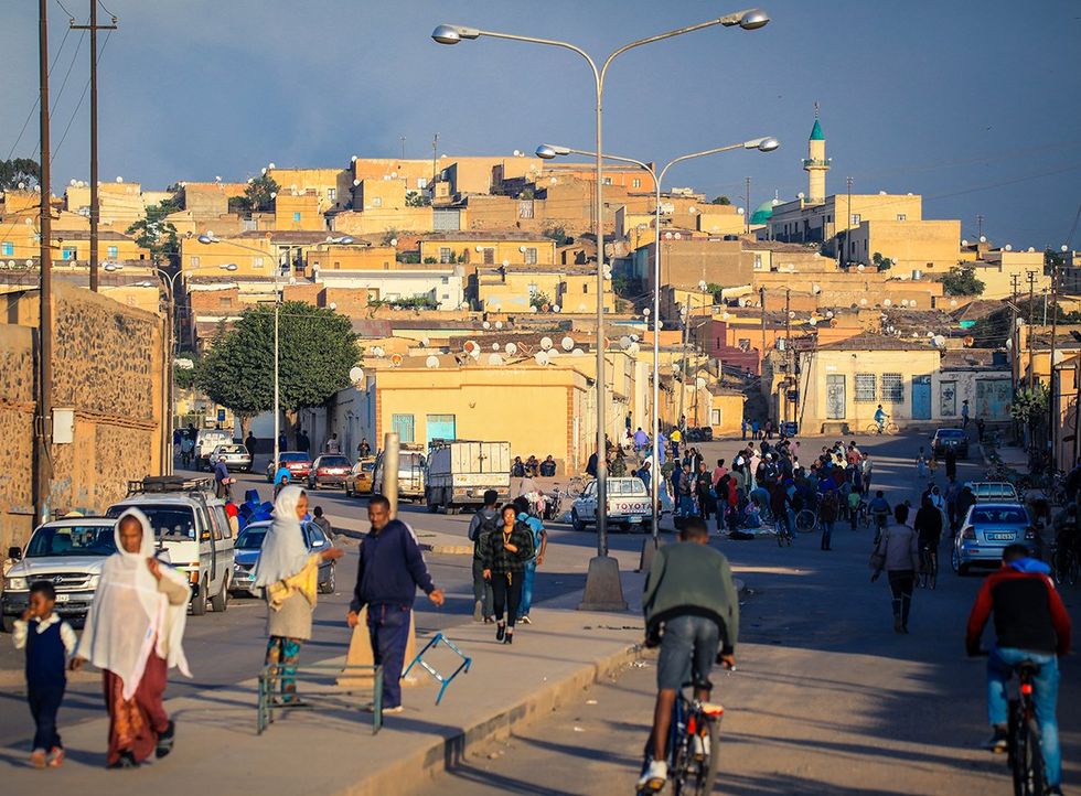 Asmara Eritrea pedestrians and bicyclists on the Central street