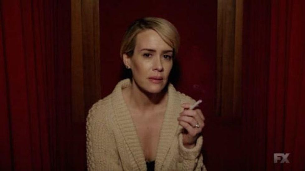 Audrey Tindall smoking a cigarette