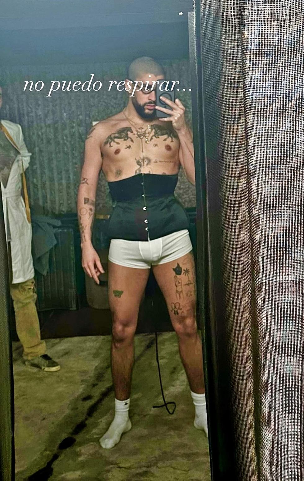 Bad Bunny wearing a corset in mirror selfie shared on Instagram Story