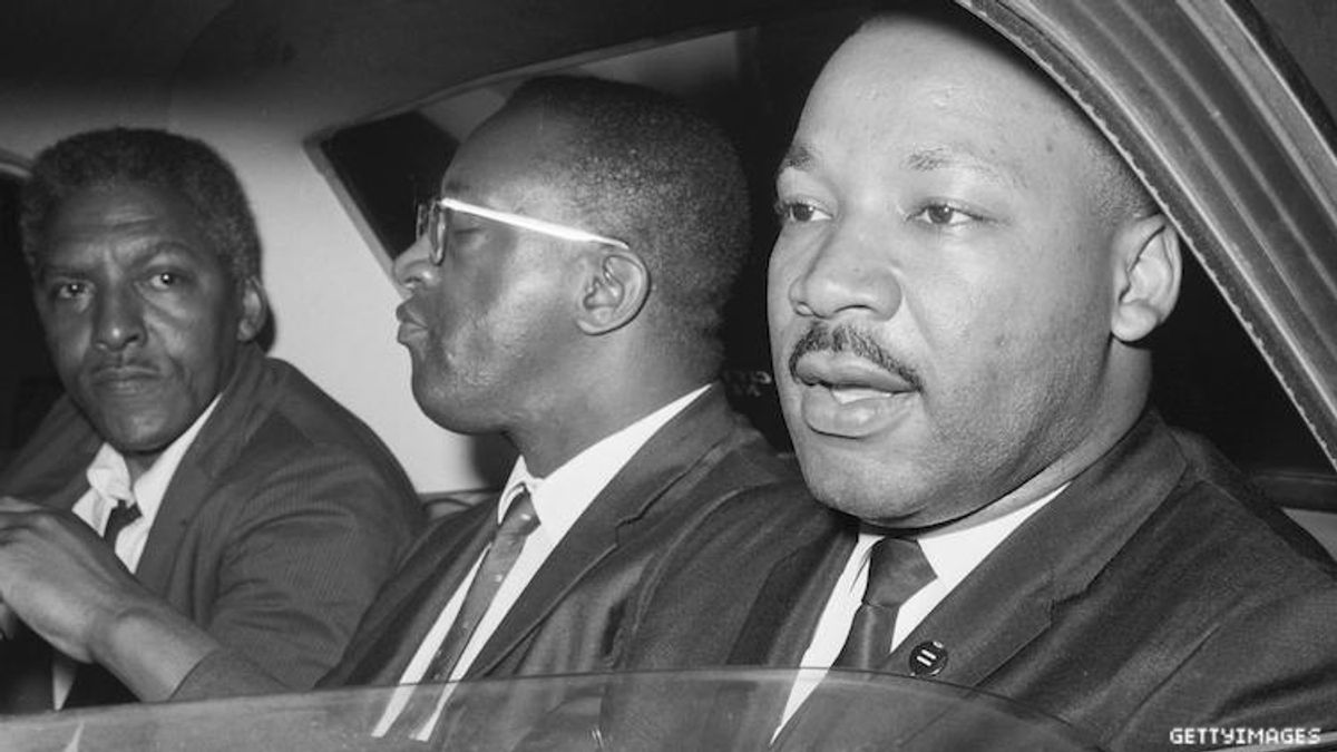 Bayard Rustin and Martin Luther King Jr. in a car. 