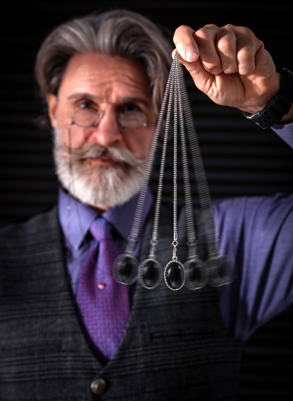 bearded man swinging pendant Hypnosis session motion effect