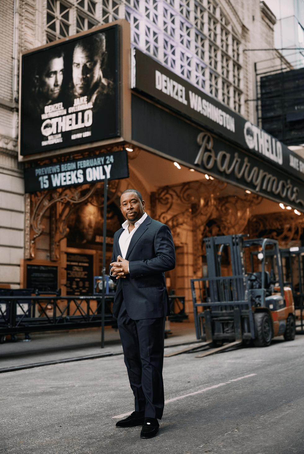 Brian Anthony Moreland standing outside the Barrymore Theatre in New York City, with an Othello marquee behind him