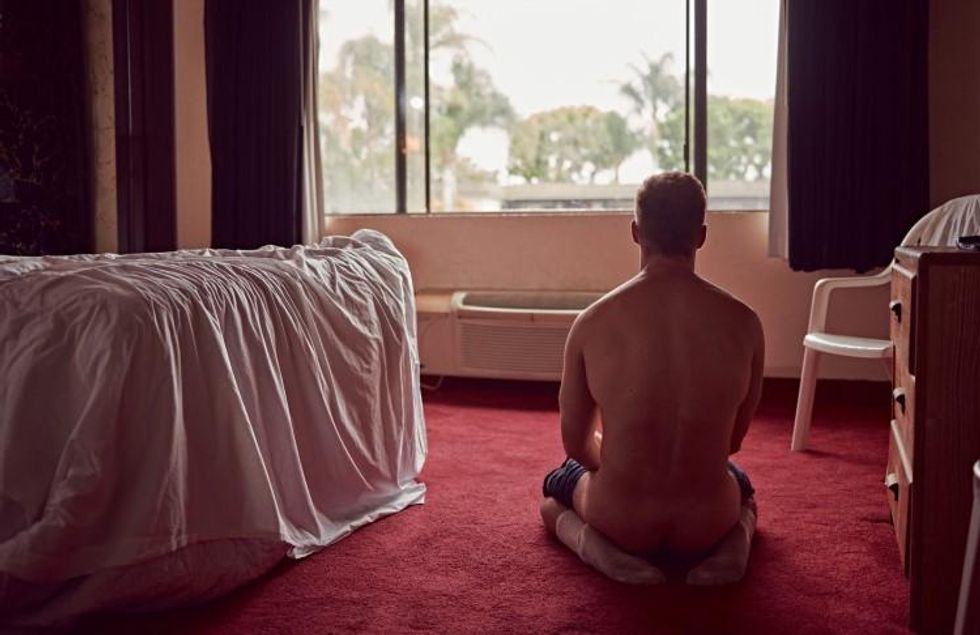 Brian Kaminsky presents Matthew Wilkas in a motel.