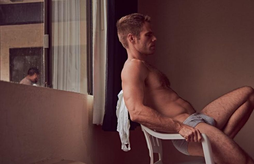 Brian Kaminsky presents Matthew Wilkas in a motel.