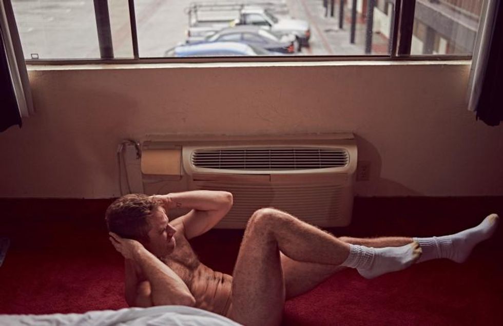 Brian Kaminsky presents Matthew Wilkas in a motel.