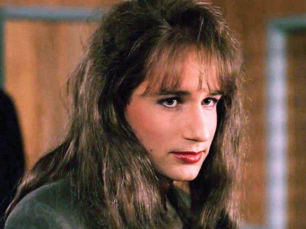 Cardigan, $1,180, and Shirt, $260 (3 pack), by Prada; Pants, $950, by Bottega Veneta.