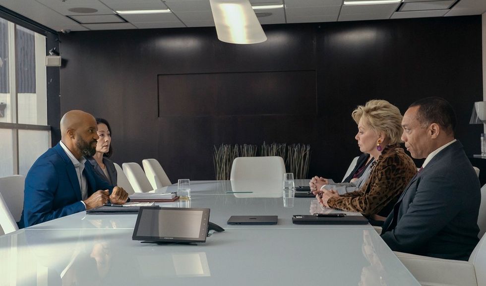 carl clemons hopkins and jean smart face off at the conference table in Hacks HBO Max show