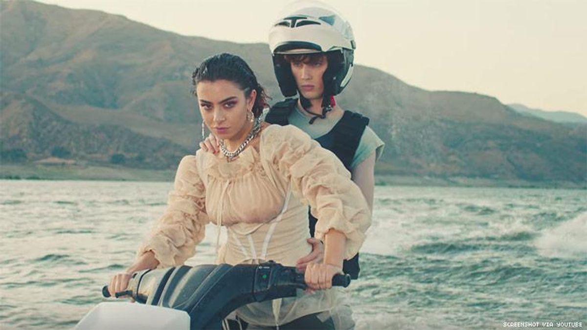 Charli XCX and Troye Sivan Jet Ski to the Future in ‘2099’ Video