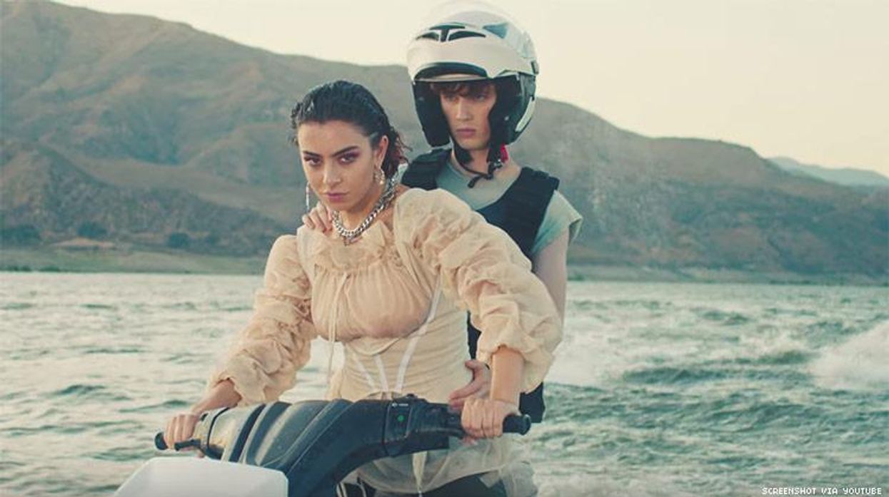 Charli XCX and Troye Sivan Jet Ski to the Future in ‘2099’ Video