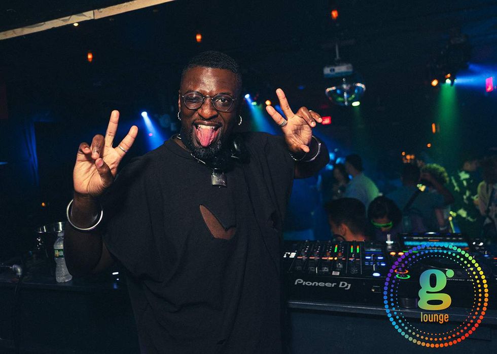 Chelsea g Lounge DJ in booth with dancefloor behind