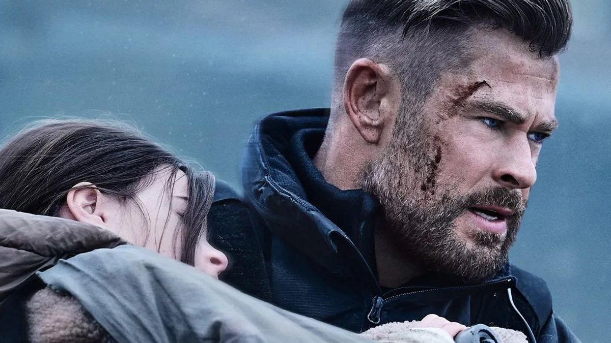 Chris Hemsworth as Tyler Rake holding a young girl in 'Extraction 2.'