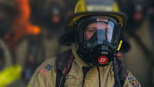 Forced to retire, a trans airman is 'passing the torch' to a firefighter waiting to serve