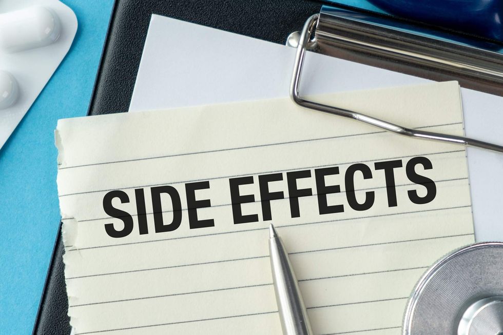 clipboard with a piece of paper that says side effects